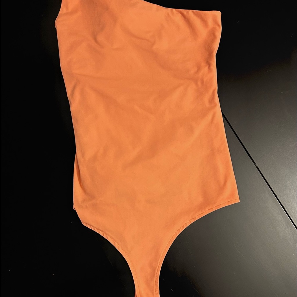 Adreamly One piece body suit with snap crotch.